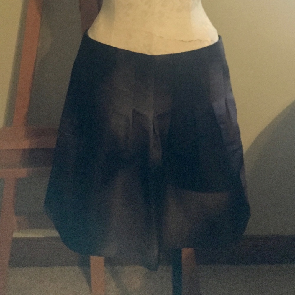 Calvin Klein black and silver mini skirt.